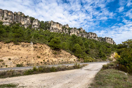 Landscape view of the karstic cliffs in large lagoon of Tobar in Beteta, Cuenca, Castilla la Mancha, Spain, Landscapes of the mountain range of Cuenca, Hoz de Betetaの写真素材