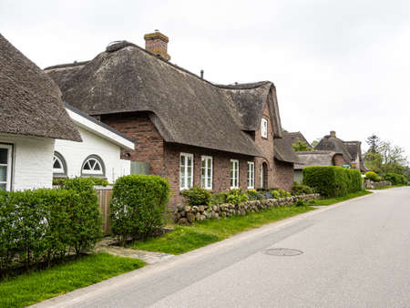 Amrum, Germany - May 29, 2021: Traditional Frisian thatched cottage in the village of Nebel on the island of Amrum, Schleswig-Holstein in Germanyのeditorial素材