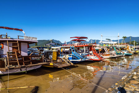 Beautiful Port of Paraty, Brazil with colorful tourist and fishing boats in the bay between Rio de Janeiro and Sao Paulo.の写真素材