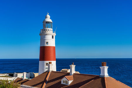 Gibraltar, United Kingdom - Nov 18, 2022: Europa Point Lighthouse, Trinity Lighthouse or Victoria Tower. Strait of Gibraltar on the background. British Overseas Territory of Gibraltar.のeditorial素材