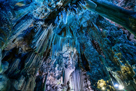 Gibraltar, United Kingdom - Nov 18, 2022: Upper Rock Nature Reserve at Gibraltar. Exploring Old St. Michaels Cave, that has been illuminated with colorful LED lighting, located at the Upper Rock Nature Reserve at Gibraltar.のeditorial素材