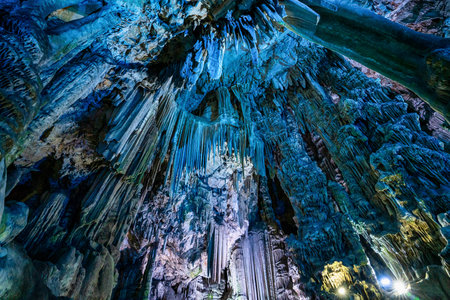 Gibraltar, United Kingdom - Nov 18, 2022: Upper Rock Nature Reserve at Gibraltar. Exploring Old St. Michaels Cave, that has been illuminated with colorful LED lighting, located at the Upper Rock Nature Reserve at Gibraltar.のeditorial素材