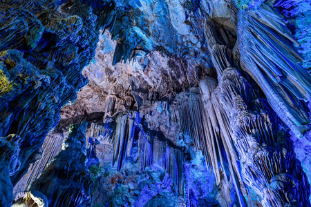 Gibraltar, United Kingdom - Nov 18, 2022: Upper Rock Nature Reserve at Gibraltar. Exploring Old St. Michaels Cave, that has been illuminated with colorful LED lighting, located at the Upper Rock Nature Reserve at Gibraltar.のeditorial素材