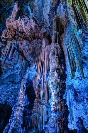 Gibraltar, United Kingdom - Nov 18, 2022: Upper Rock Nature Reserve at Gibraltar. Exploring Old St. Michaels Cave, that has been illuminated with colorful LED lighting, located at the Upper Rock Nature Reserve at Gibraltar.のeditorial素材