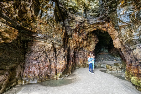 Ribadeo, Spain - Jun 22, 2023: Natural rock arches Cathedrals beach, Playa de las catedrales at Ribadeo, Galicia, Spain. Famous beach in Northern Spain Atlantic.のeditorial素材