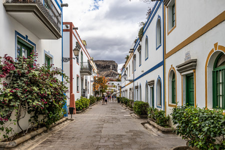 Gran Canaria, Spain - Feb 21, 2023: Streets in the port city of Gran Canaria, Puerto de Mogan. The white facades of the houses decorated with blooming flowers. Canary Islands Spainのeditorial素材