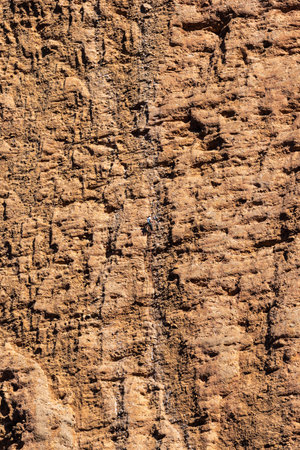 Riglos, Spain - Oct 25, 2022: Climber in Mallos de Riglos, tourist destination, rock formations, erosion, geology, geological interest, murallones, ideal for mountaineers Aragon Spainのeditorial素材