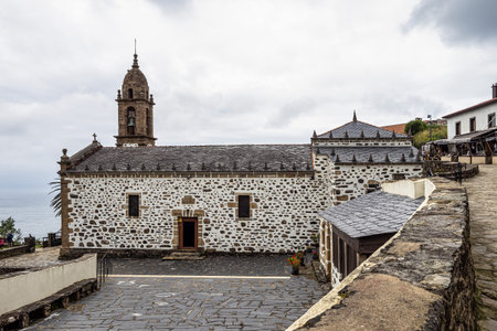 Teixido, Spain - Jun 23, 2023: Church of San Andres de Teixido in Galicia, Spain, in the Rias Altas region. This church is a famous pilgrimage place on the most Northern part of Spain.のeditorial素材
