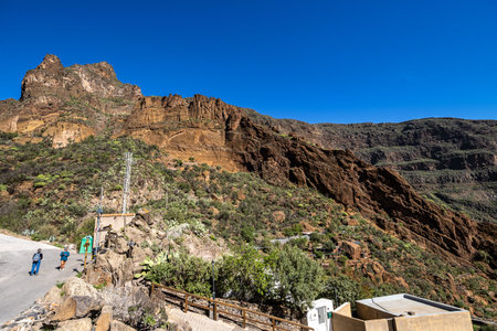 Gran Canaria, Spain - Feb 14, 2023: Hiking from Barranco de Guayadeque to Caldera de los Marteles, a volcanic area with dry fields at the bottom, Gran Canaria, Canary Island, Spain, Europeのeditorial素材