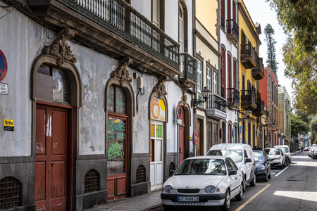 Las Palmas, Spain - Feb 22, 2023: Small pedestrian cobblestone street with colorful facades of houses in old district Vegueta. Las Palmas, Gran Canaria, Spainのeditorial素材