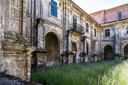 Oseira, Spain - Jul 02, 2023: Courtyard of the monastery of Oseira at Ourense, Galicia, Spain. Monastery of Santa Maria la Real de Oseira. Trappist monastery. Arched buildings and fountain.のeditorial素材