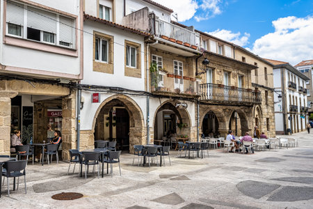 Noia, Spain - Jun 27, 2023: General view of the Tapal square and adjoining buildings, in the urban center of the city of Noia in Galicia, Spainのeditorial素材