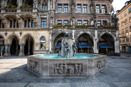 Munich, Germany - Jun 18, 2023: Fish Fountain, Fischbrunnen in front of the New New Town Hall at Marienplatz, the historic center square in Munich, Germanyのeditorial素材