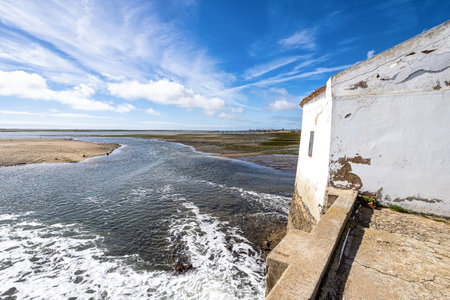 Tide mill building in Ria Formosa Natural Park, Olhao, Algarve in Portugalの写真素材