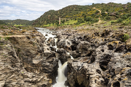 Canyon, rapids and waterfalls of the Guadiana river in Mertola, Portugal in the natural site known as the Leap of the wolf, Pulo do Lobo. The Guadiana Valley Natural Park.の写真素材