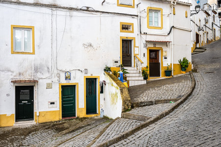 Typical Portuguese facades and cobblestone streets in Elvas, Portugal, Europe