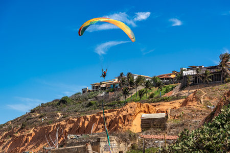 Paraglider pilot at Canoa Quebrada Beach at Aracati in Ceara Brazil. Bay Coastline. Coast Travel....