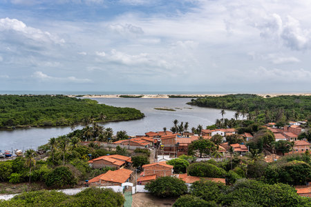 Village of Mandacaru, Barreirinhas, Maranhao, Brazil. Photo taken from the top of the Mandacaru lighthouse, overlooking the Preguicas River, and the Atlantic Ocean in the background.の写真素材