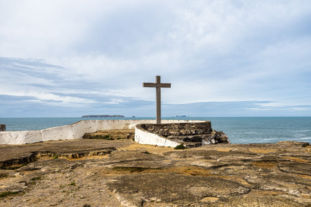 Cross on the coast of the Atlantic Ocean at Cruz dos Remedios, Peniche peninsula, Portugal in Europeの写真素材