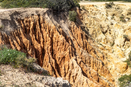 Praia da Marinha Beach among rock islets and cliffs seen from Seven Hanging Valleys Trail, Percurso dos Sete Vales Suspensos. Portugalの写真素材