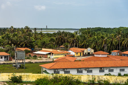 Village of Mandacaru, Barreirinhas, Maranhao, Brazil. Photo taken from the top of the Mandacaru lighthouse, overlooking the Preguicas River, and the Atlantic Ocean in the background.の写真素材
