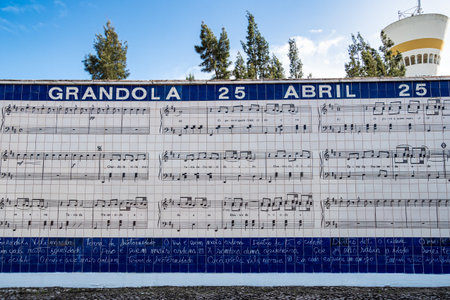 Tile mural with carnation and lyrics from the commemorative song of the 25th of April Grandola Vila Morena in Grandola, Portugal in Europeの写真素材