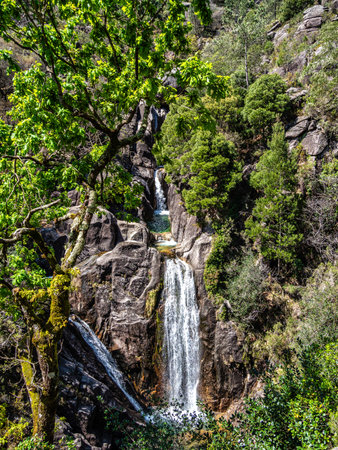 The beautiful Arado Waterfall, Cascata do Arado at the Peneda Geres National Park in northern...
