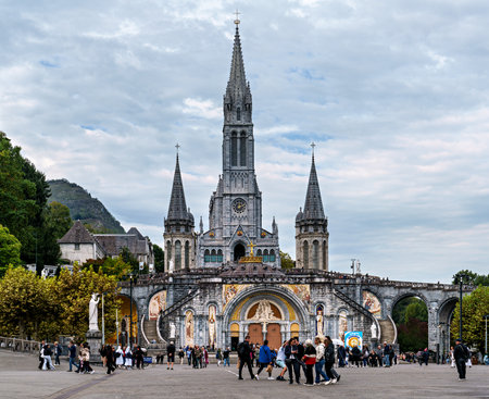 Lourdes, France - Sep 28, 2025: View of the Basilica in the Sanctuary of Lourdes, France. Mayor pilgrimage spot for Catholics all around the worldのeditorial素材