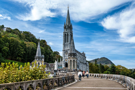 Lourdes, France - Sep 28, 2025: View of the Basilica in the Sanctuary of Lourdes, France. Mayor pilgrimage spot for Catholics all around the worldのeditorial素材