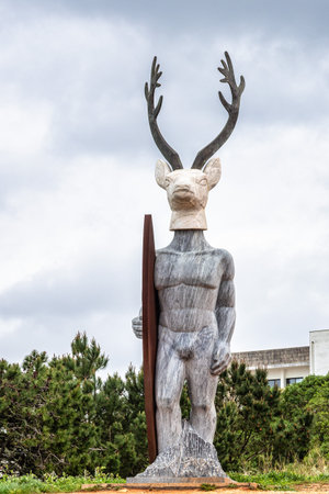 Deer Statue, a surfer with a deer head with 6 meters high, installed at the lighthouse road of Nazare, Portugal in Europeの写真素材