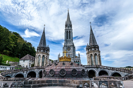 View of the Basilica in the Sanctuary of Lourdes, France. Mayor pilgrimage spot for Catholics all around the worldの写真素材