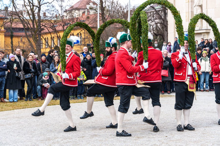Munich, Germany - Feb 08, 2026: Traditional dance of the coopers guild in historical dresses, performed every seven years during the carnival season in Munich, Bavaria in Germanyのeditorial素材
