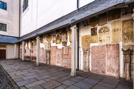 Passau, Germany - Apr 16, 2025: St. Stephans cathedral in Passau, Germany is an old white church with green metal domes on top of the towers. In front of the Church is a statue of Maximillian Josephのeditorial素材