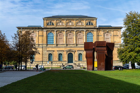 Munich, Germany - Oct 14, 2025: Main facade of the Old Pinakothek museum with the abstract sculpture by Eduardo Chillida called Buscando la Luz in front of the building.のeditorial素材