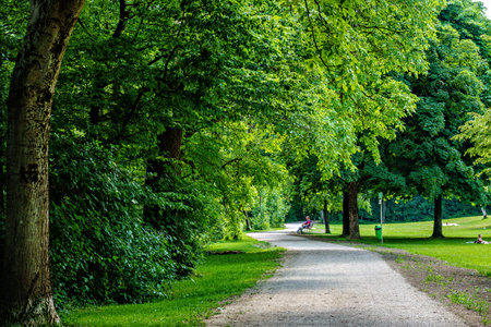 Munich, Germany - Jun 17, 2025: Hiking along the banks of the Bavarian River Wuerm with detailed views of green nature. Between Munich Pasing and the village Graefelfingのeditorial素材