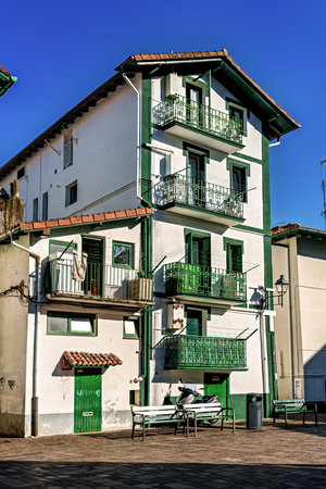 Historic Colorful Buildings, Red Shutters, Flower Balconies, Cobblestone Street, Traditional Architecture in Hondarribia, Basque Country, Spainの写真素材