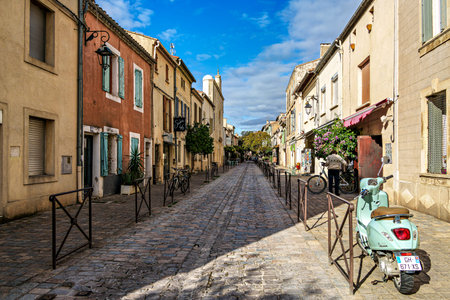 Aigues Mortes, France - Nov 05, 2025: The houses of the historic city center of Aigues-Mortes in France, Occitanie, Gard in Europe seen from above the medieval wallsのeditorial素材