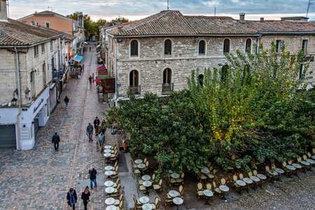 Aigues Mortes, France - Nov 05, 2025: The houses of the historic city center of Aigues-Mortes in France, Occitanie, Gard in Europe seen from above the medieval wallsのeditorial素材