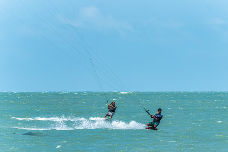 Barra Grande, Brazil - Jan 22, 2026: Kite surfing at Barra Grande beach on the coast of Piaui in...