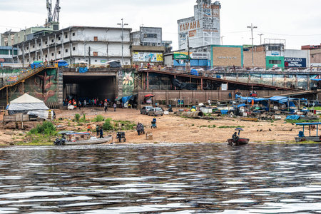Manaus , Brazil - Dec 27, 2025: Passengers disembark from tour ferry boats at the harbor Porto Balsa Amarela, Ferry port Yellow in Manaus in Brazilのeditorial素材