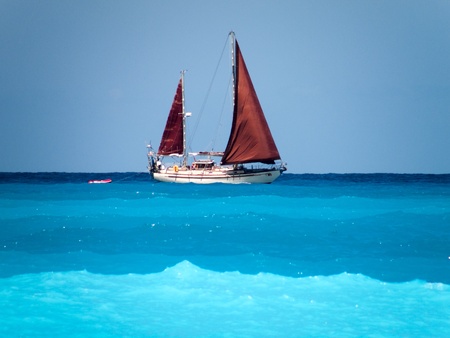 Sailing boat Stunning shades of blue water and sailboat at the open Ionian sea