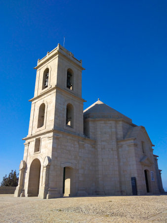 Nossa Senhora da GraÃ§a, Monte Farinha, Portugal against a perfect blue skyの写真素材
