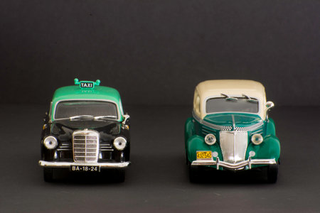 Classic vintage car taxi toy isolated on black background with copy space for textの写真素材