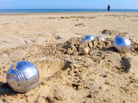 Petanque balls on the beachの写真素材