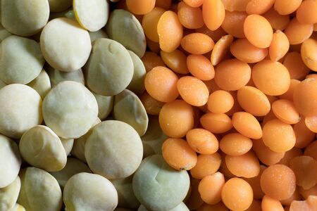 Detail of red lentil and green lentil grains diagonally bisected