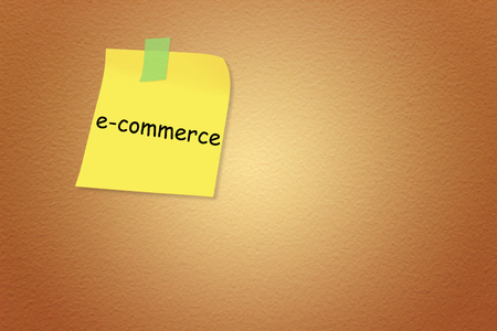 Paper note with sticky tape isolated on background textured brownの写真素材