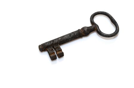 photo of an old rusty keys isolatedの写真素材