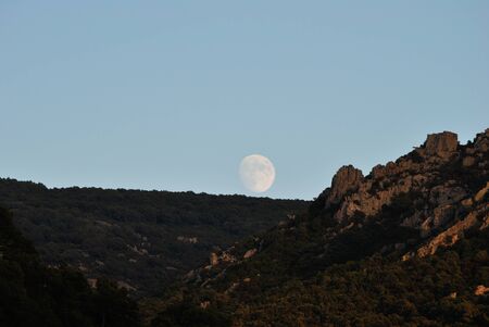 The moon over the mountainsの写真素材