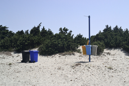 Separate waste in the beachの写真素材