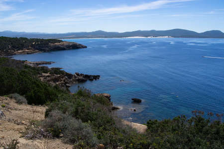 View of the coast of Porto Pineddu, in the background the dunes of Arenas Biancasの写真素材